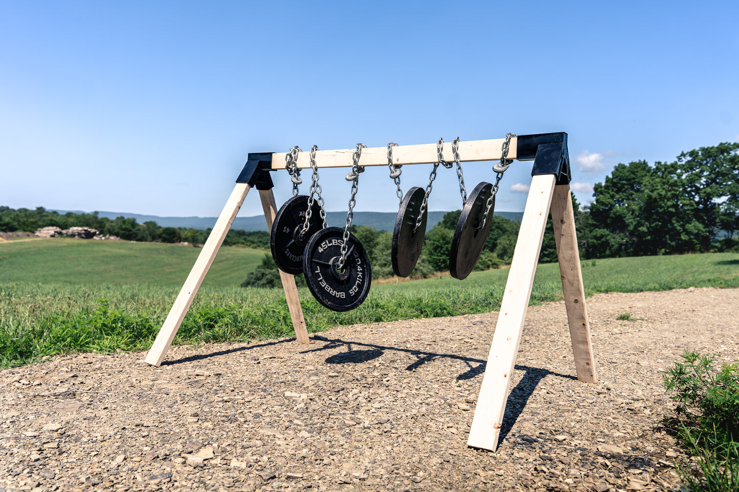 workout plates mounted to target stand to show strength and durability of the shooting target stand