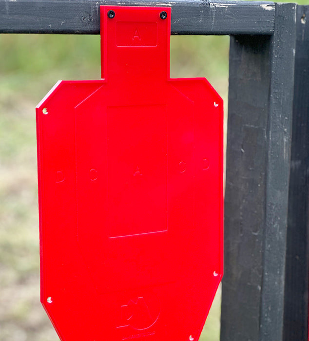 close image of red half silhouette shooting target used for target practice