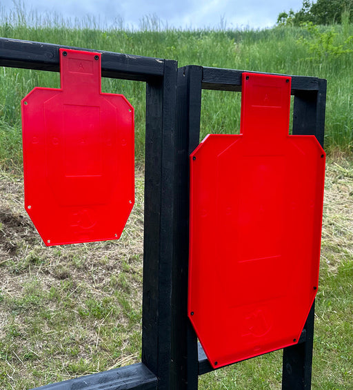 full size and half size red silhouette shooting target mounted to black shooting stand used for shooting targets