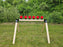 row of self healing targets mounted to a shooting stand at an outdoor shooting range