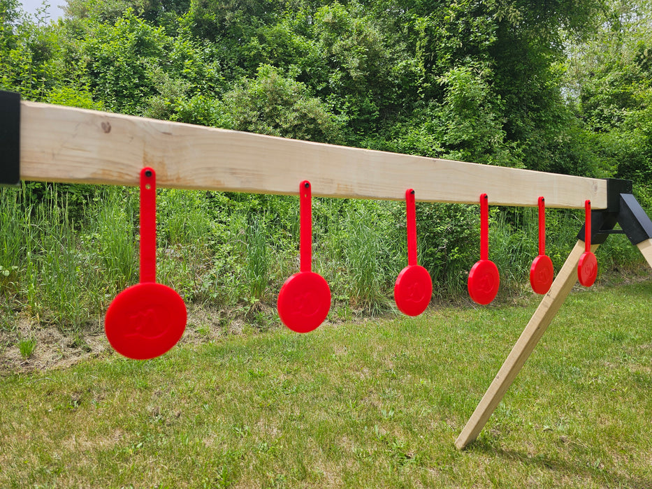 row of red shooting targets at a gun range