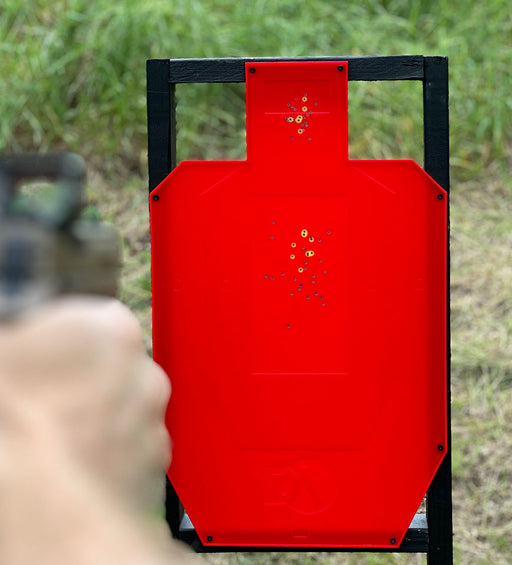 person shooting full size uspsa target changing color and self healing at gun range