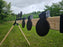 row of knockdown targets mounted to shooting stand used for gun range targets