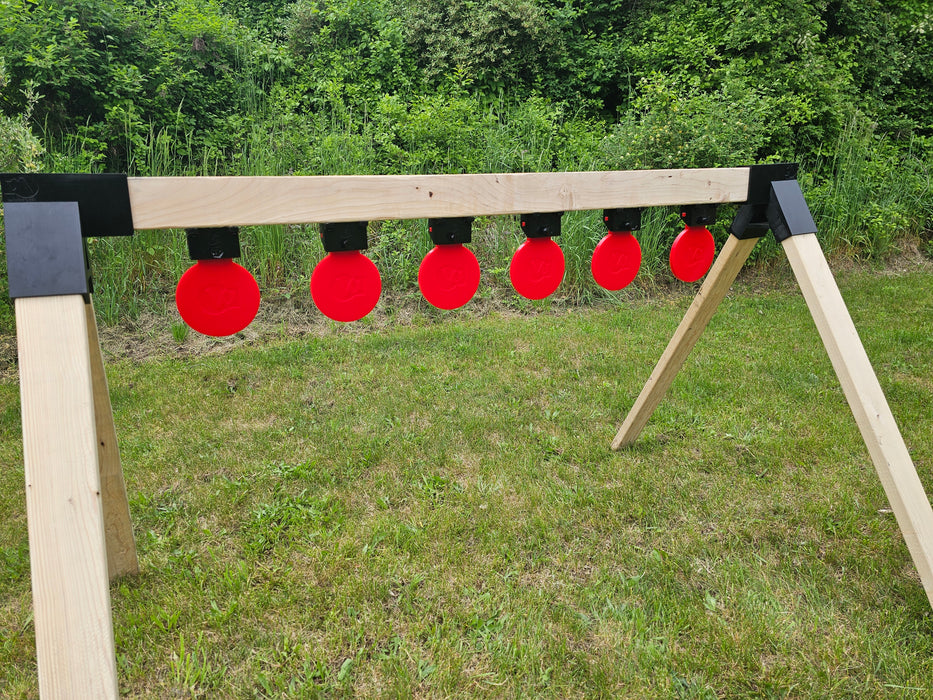 row of self healing targets mounted upside down as swinging targets used as targets for shooting